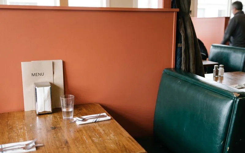 Restaurant booth wall freshly painted in a warm satin finish