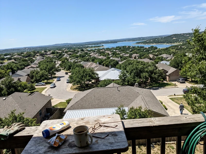 Georgetown Hill Country neighborhood with limestone homes and live oaks under a bright Texas sky