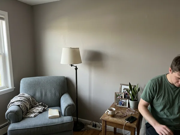 After: the same wall evenly painted with no visible repairs