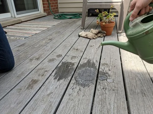 Water soaking into weathered deck boards